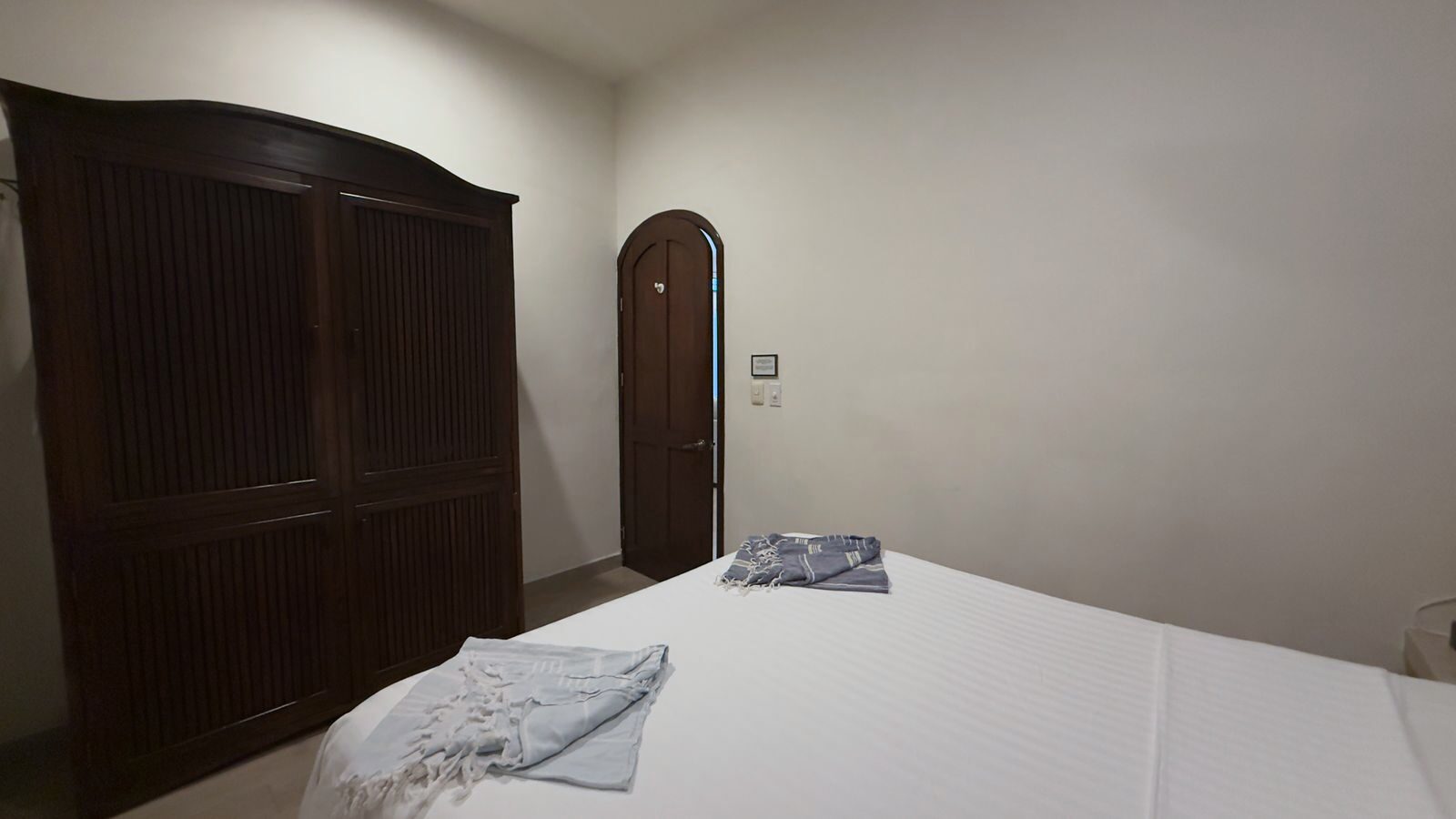 Guest bedroom with clean design at Caribbean vacation rental