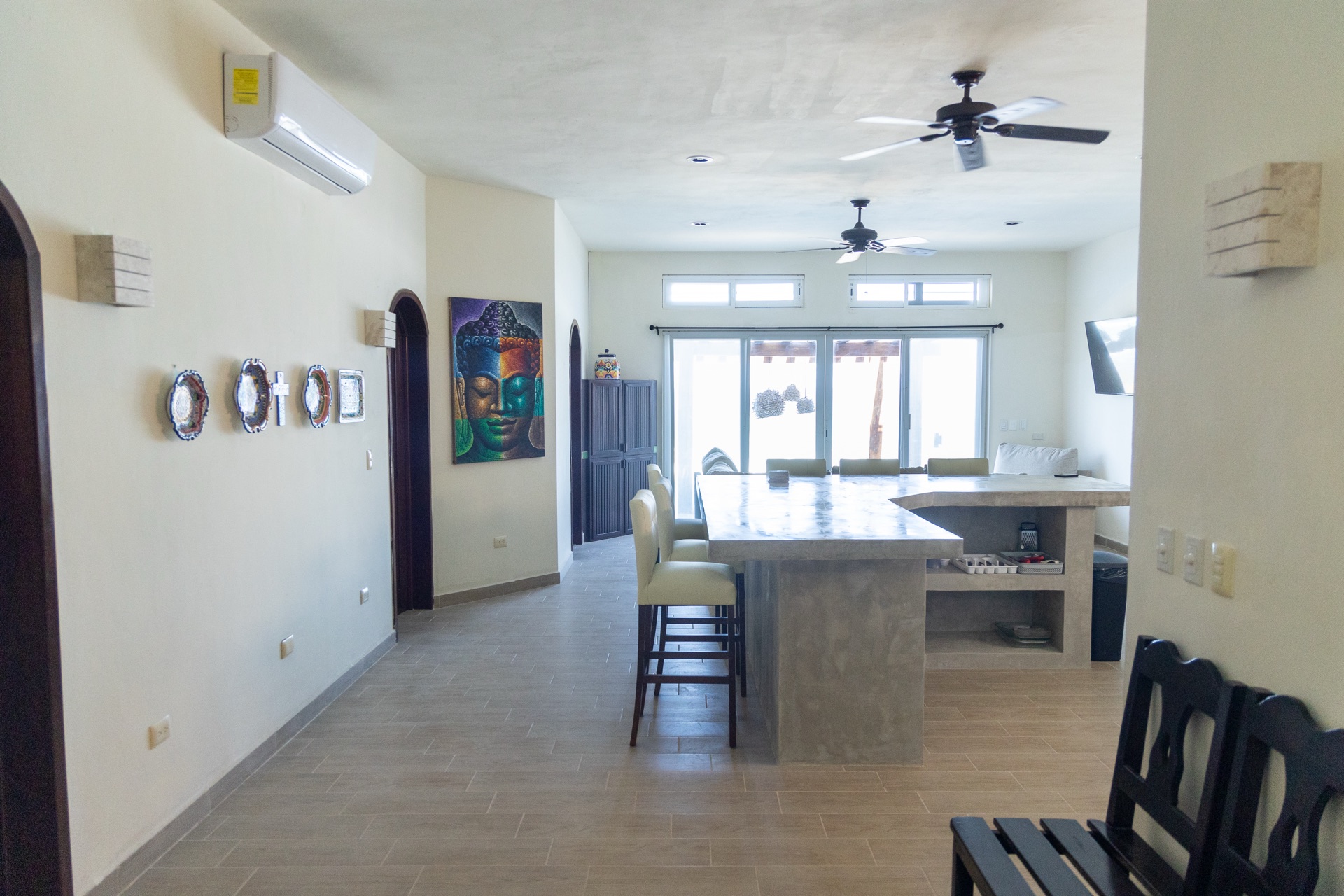 Dining and kitchen area with concrete island — Rincón del Descanso Isla Mujeres