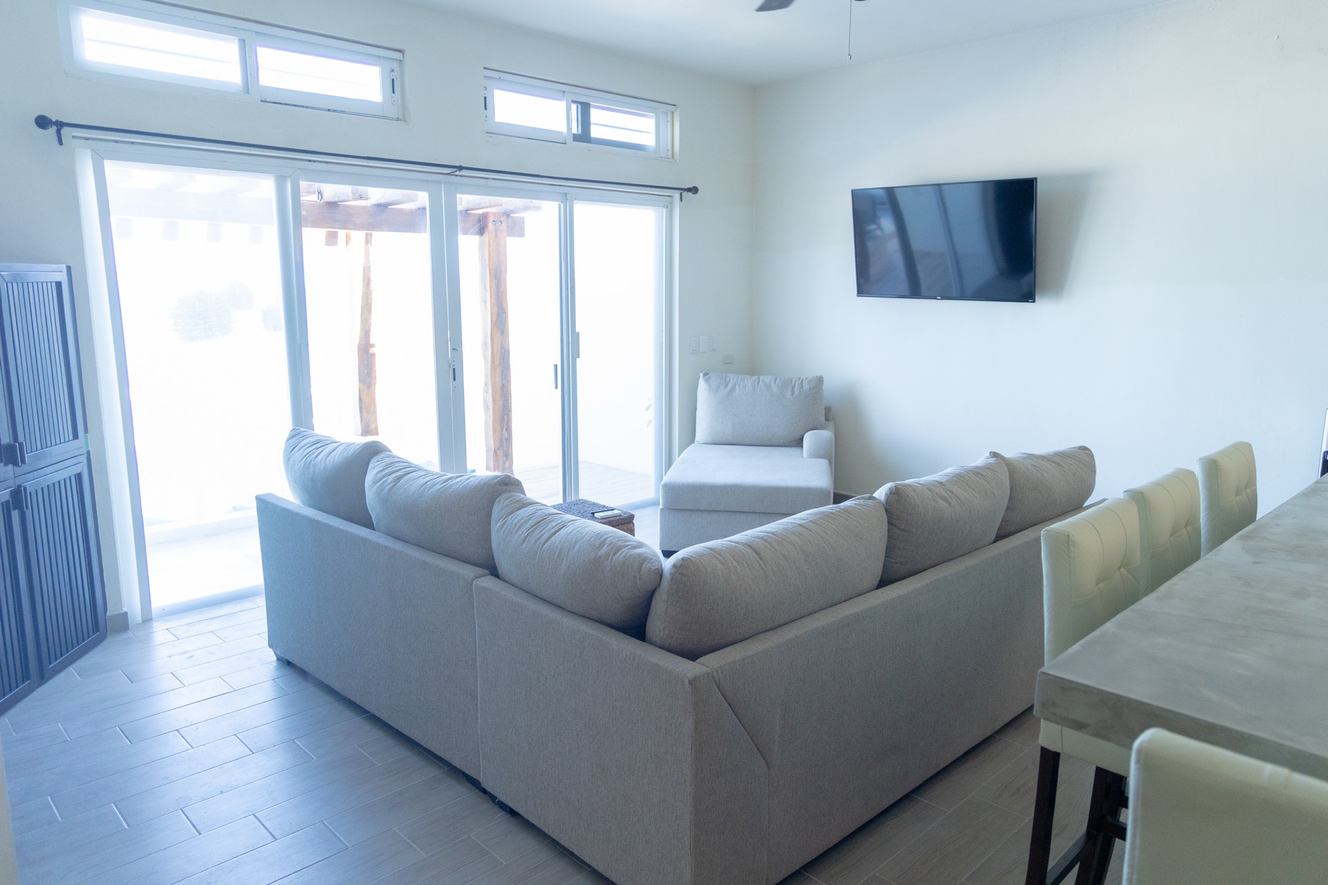 Living room with sectional and patio doors Isla Mujeres vacation rental