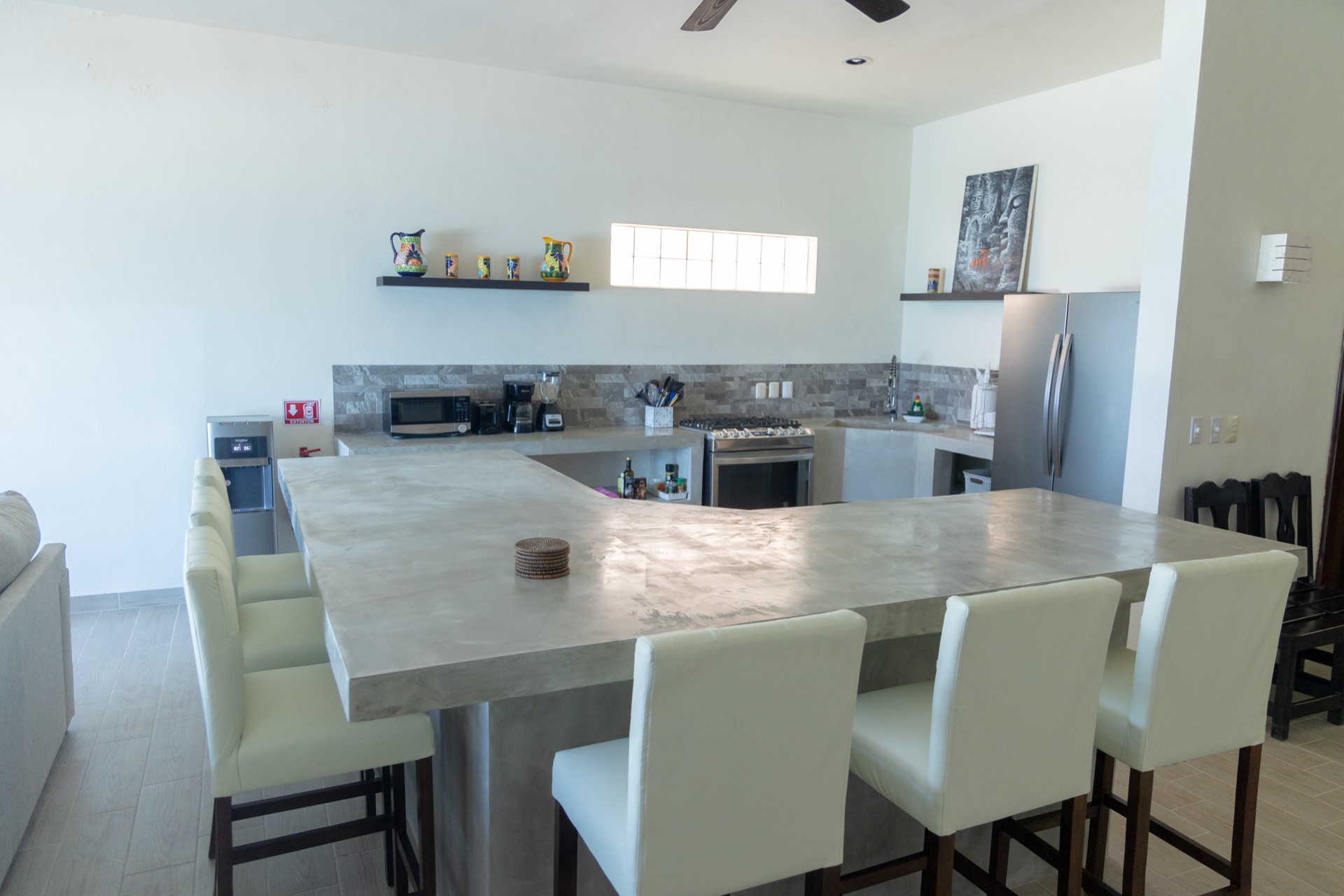 Dining table with chairs at the concrete island Isla Mujeres vacation rental