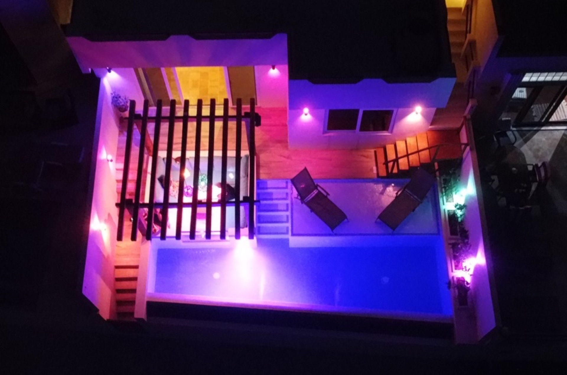 Evening aerial of the property with pool lighting — Rincón del Descanso Isla Mujeres