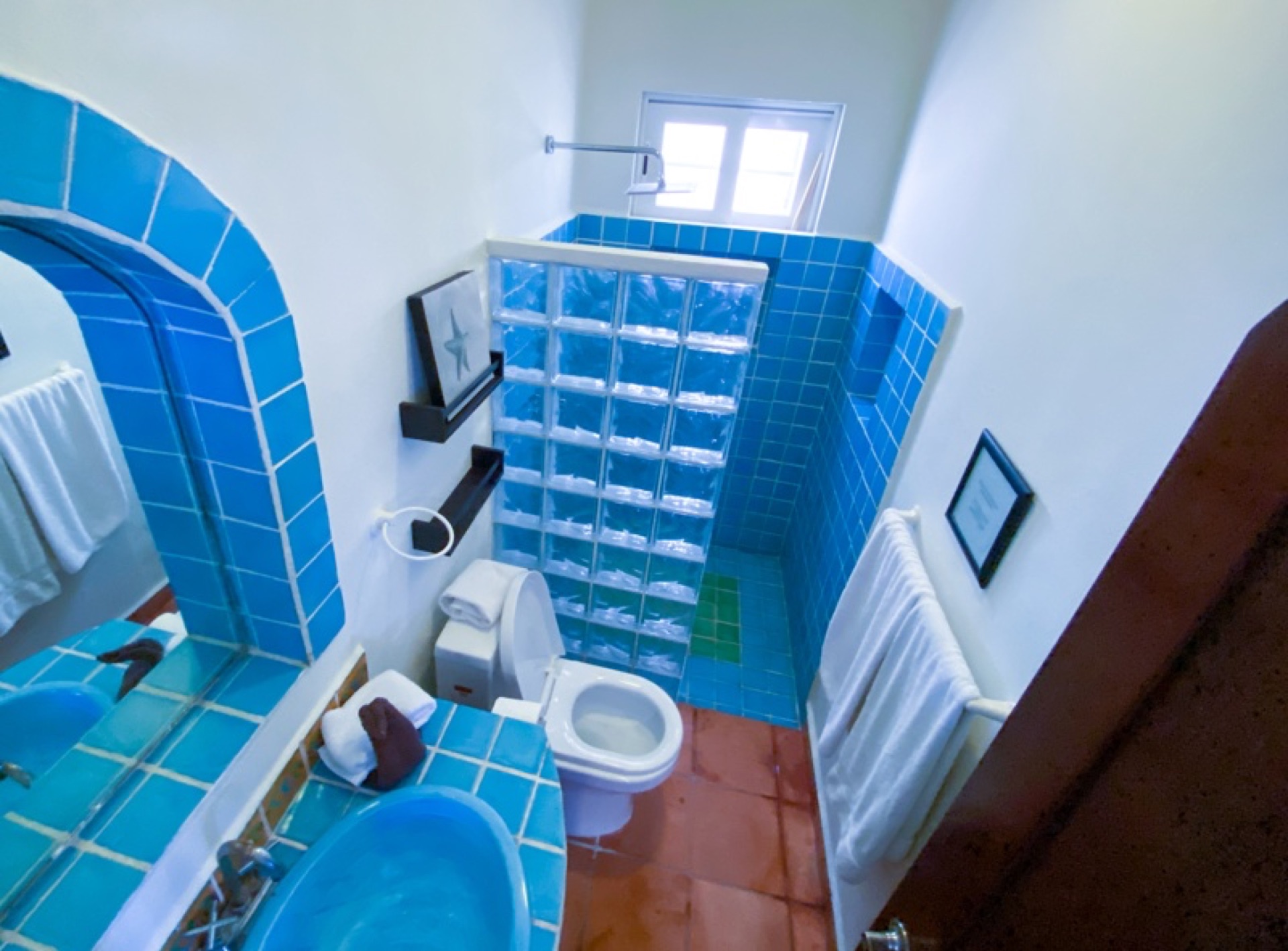 Bathroom with arched mirror Isla Mujeres
