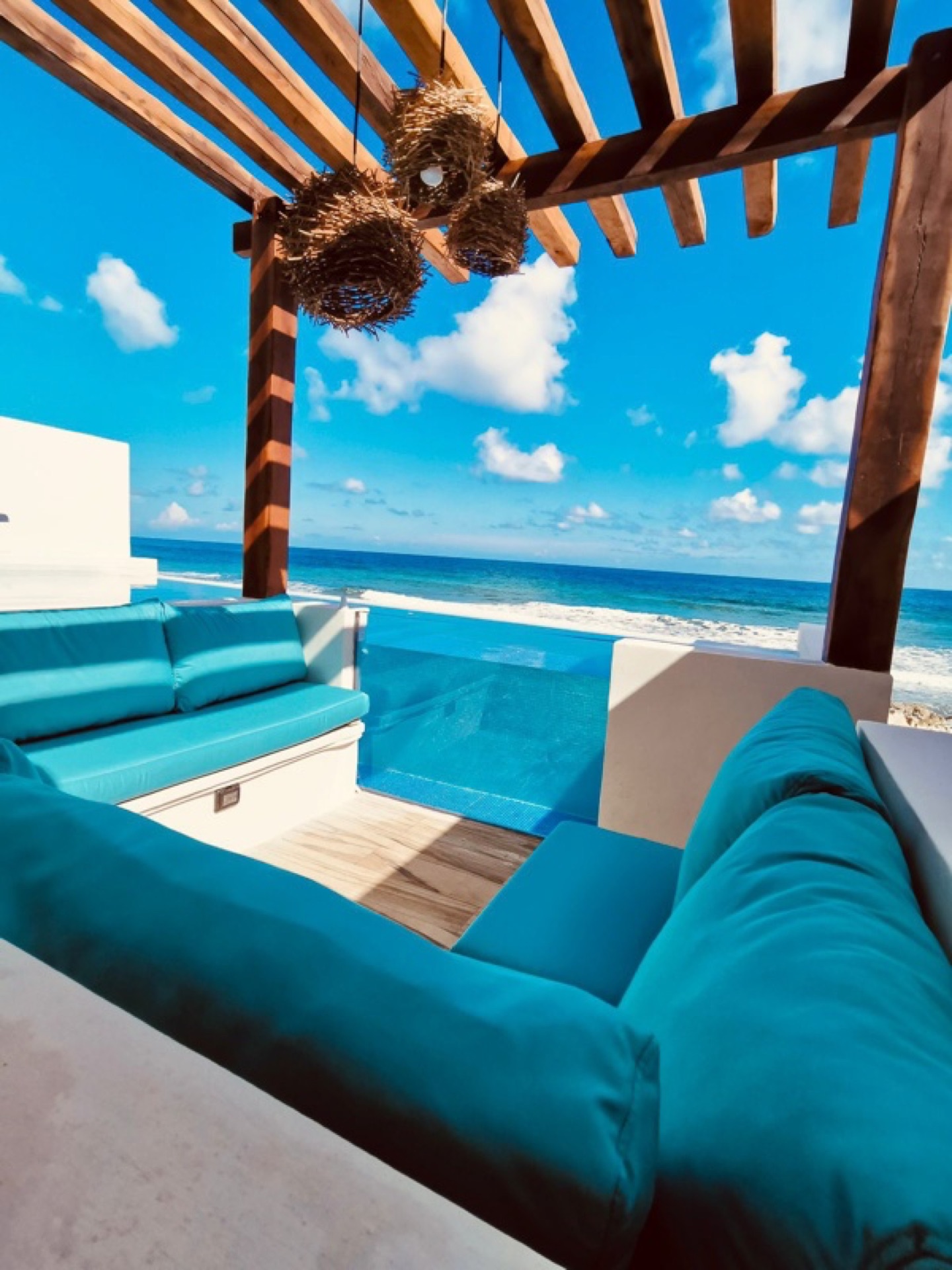 Rooftop pergola seating with ocean view — Rincón del Descanso Isla Mujeres