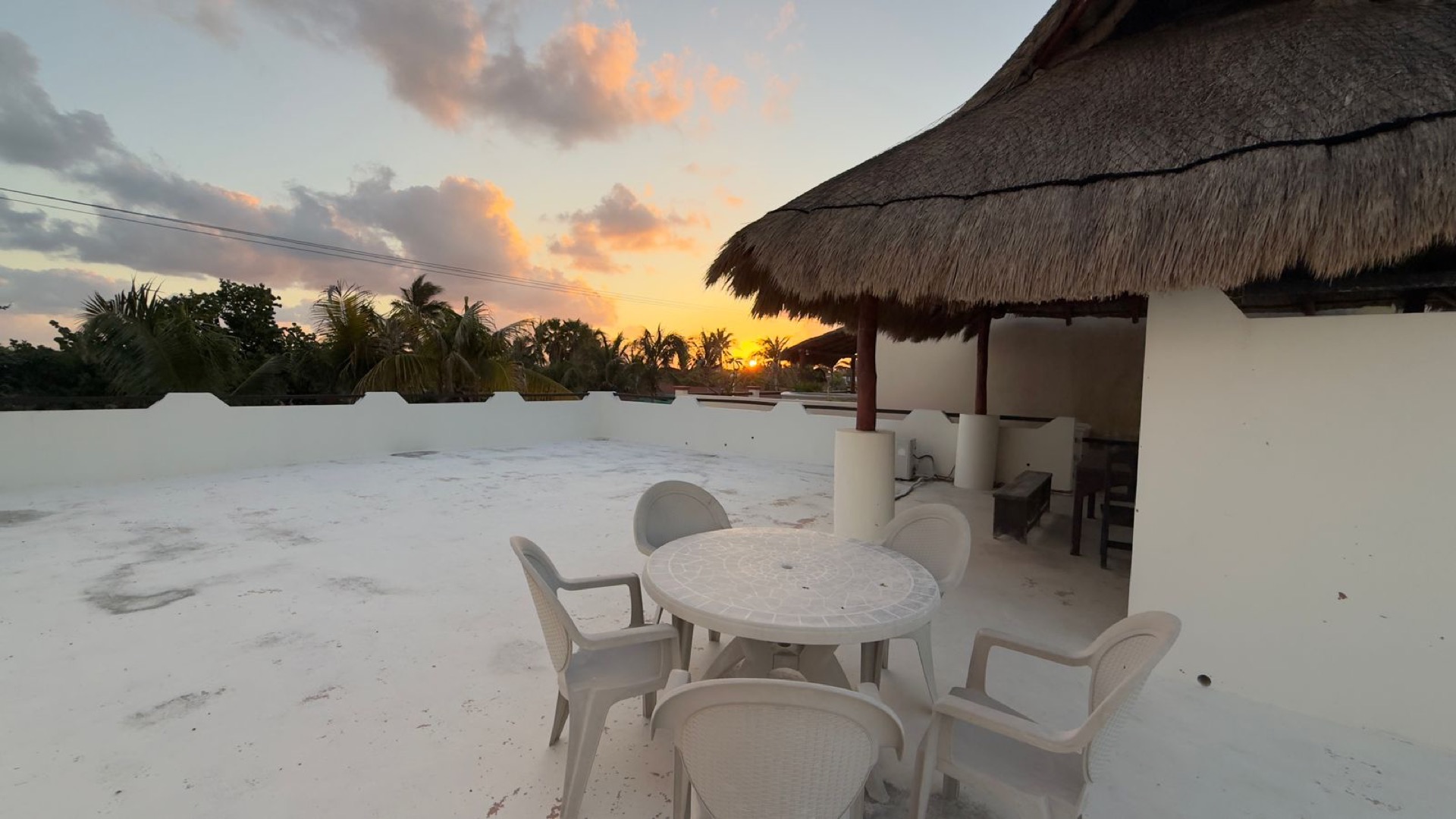 Rooftop terrace at golden hour Isla Mujeres oceanfront home