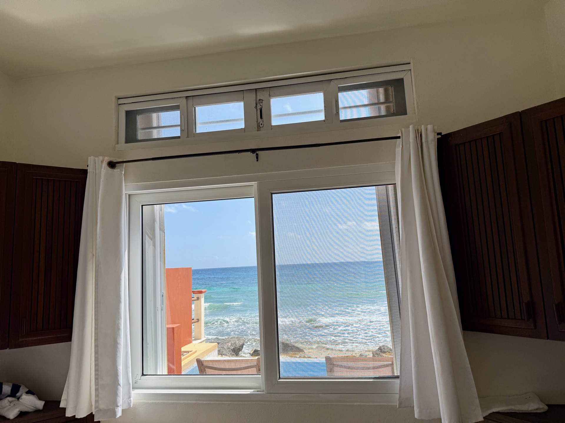 Bedroom window view of the pool and Caribbean Sea at Rincón del Descanso Isla Mujeres