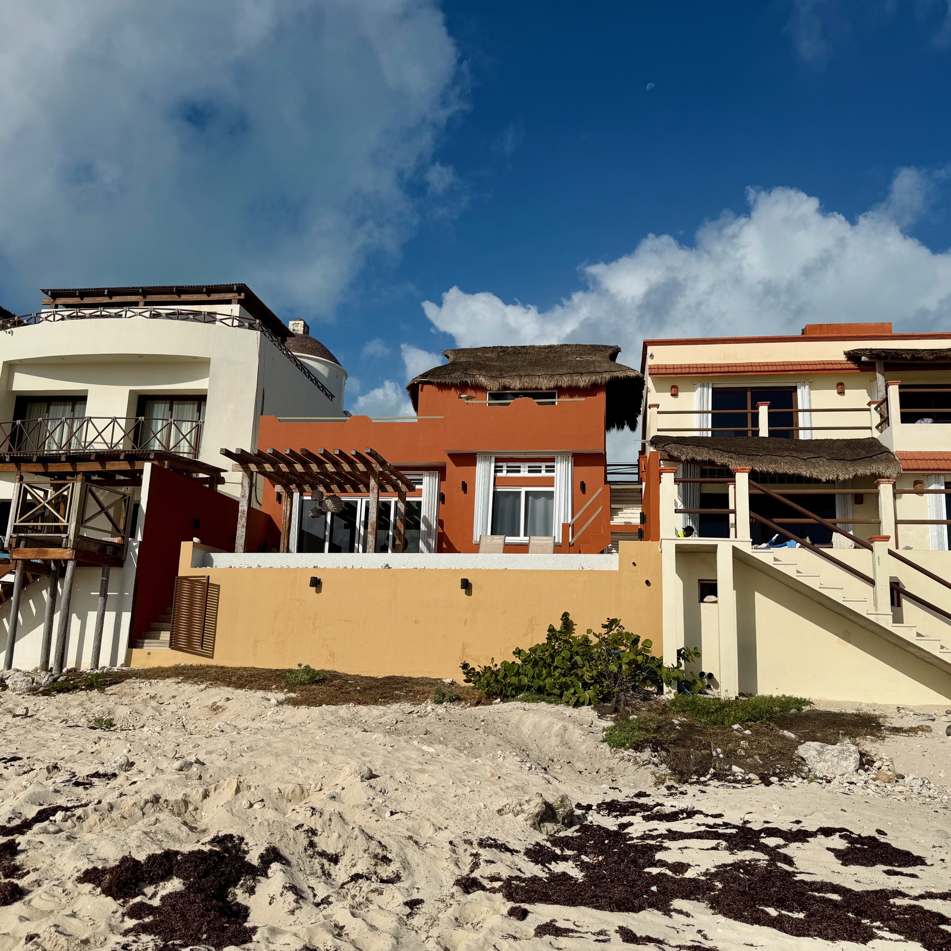 Beachfront facade of Rincón del Descanso viewed from the sand Isla Mujeres