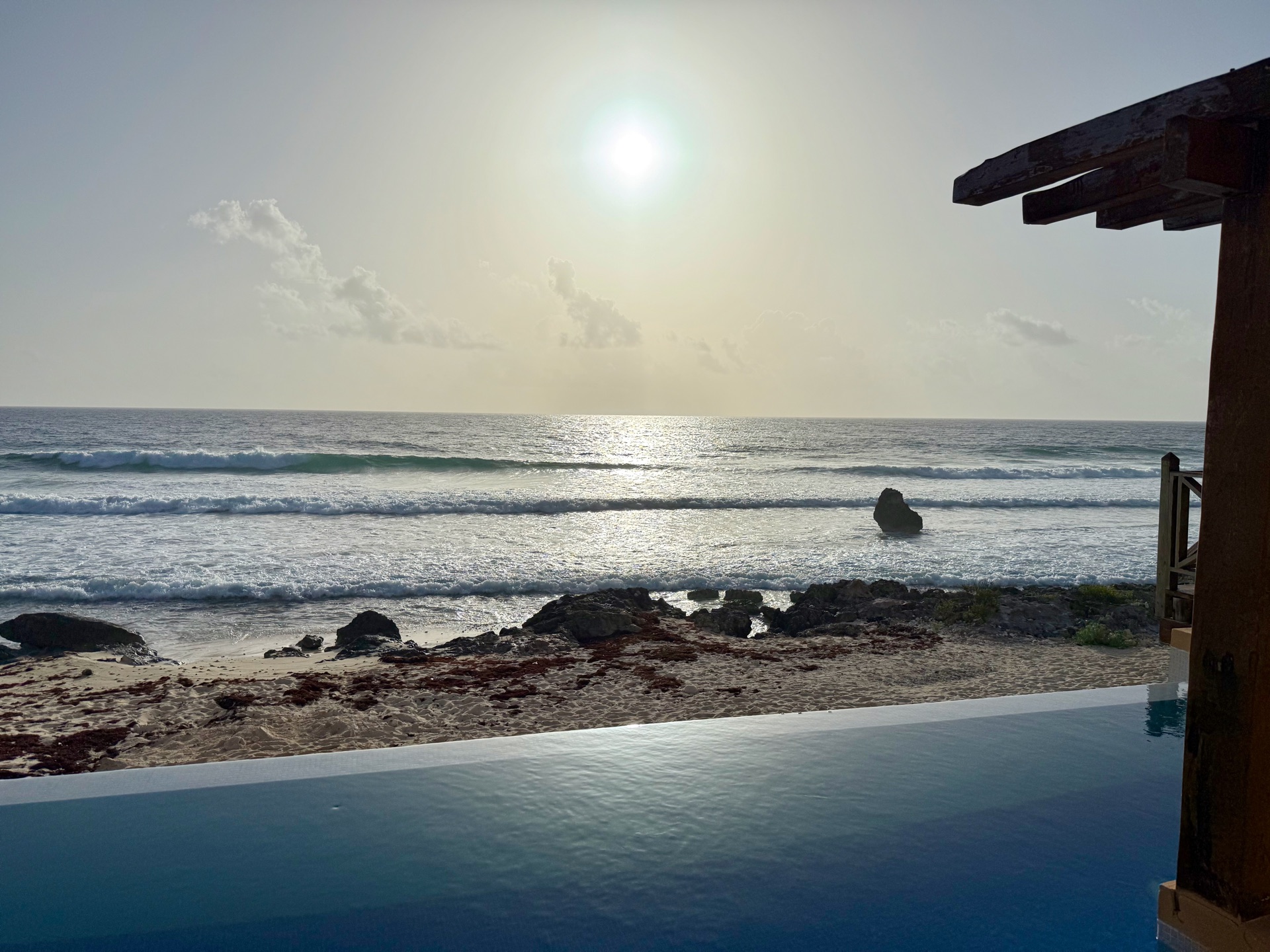 Sunset over the Caribbean Sea from the pool deck at Rincón del Descanso, Isla Mujeres