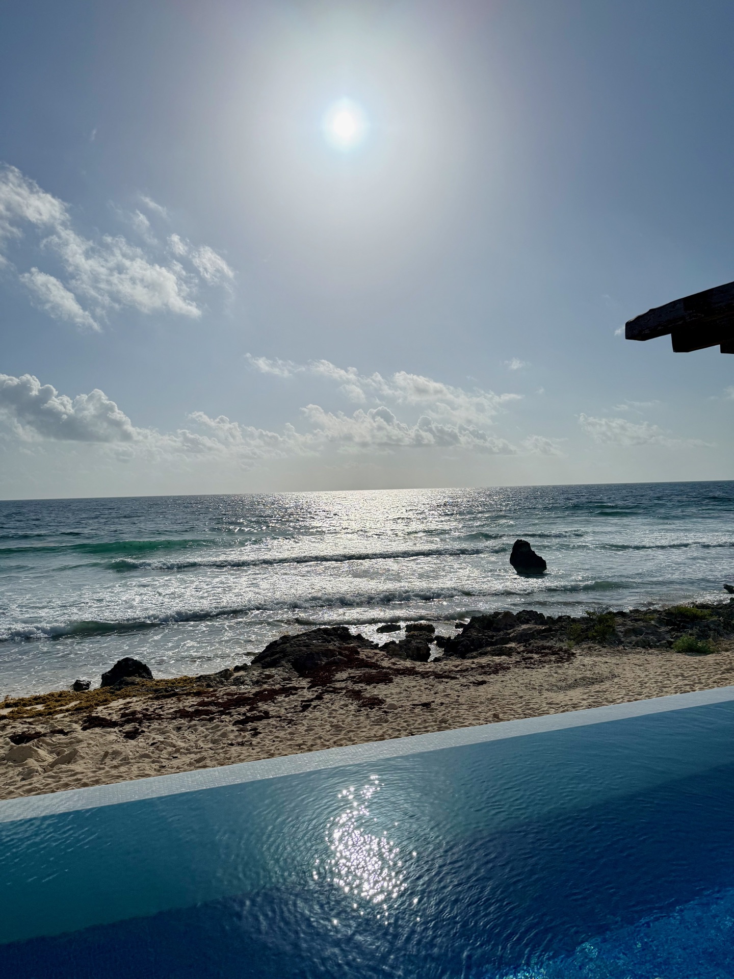 Infinity pool and pergola at sunset overlooking the Caribbean Sea Isla Mujeres